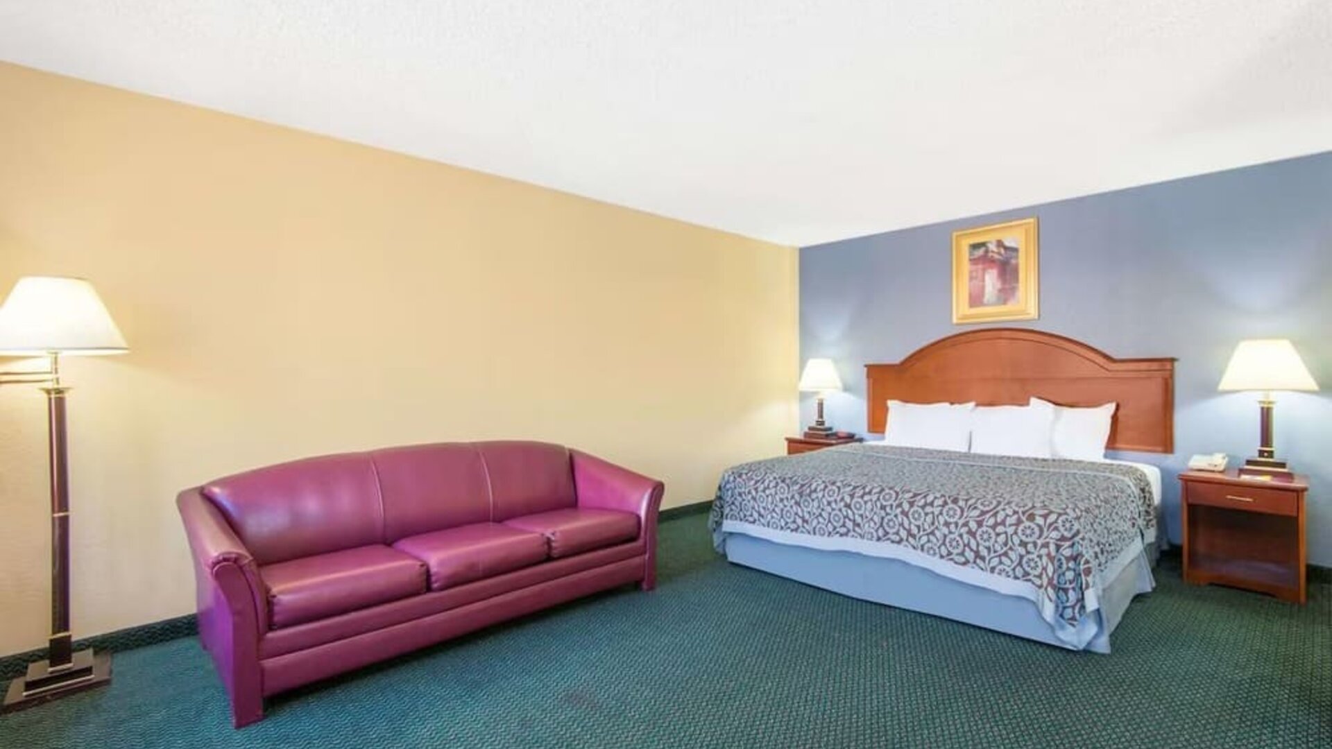 Spacious day use room with sofa at Blue Way Inn & Suites Wichita East.