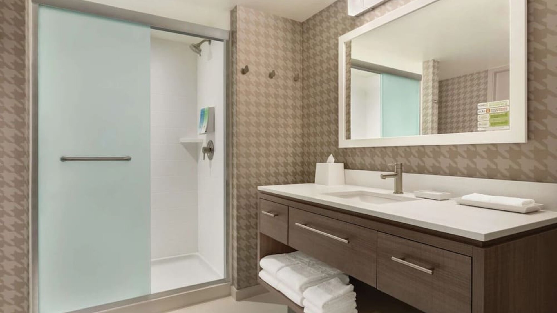 Guest bathroom with shower at Home2 Suites By Hilton Chicago River North.
