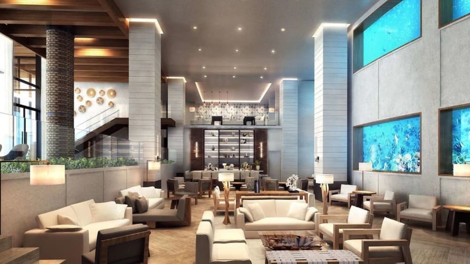 Lobby and coworking lounge beside the oceanarium at Alohilani Resort Waikiki Beach.