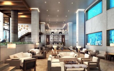 Lobby and coworking lounge beside the oceanarium at Alohilani Resort Waikiki Beach.