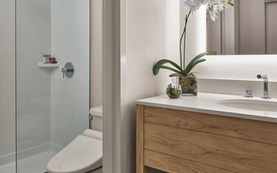 Guest bathroom with shower at Alohilani Resort Waikiki Beach.