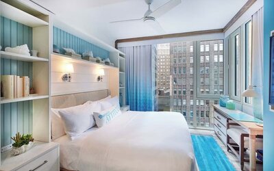 King bed with city views at Margaritaville Resort Times Square.