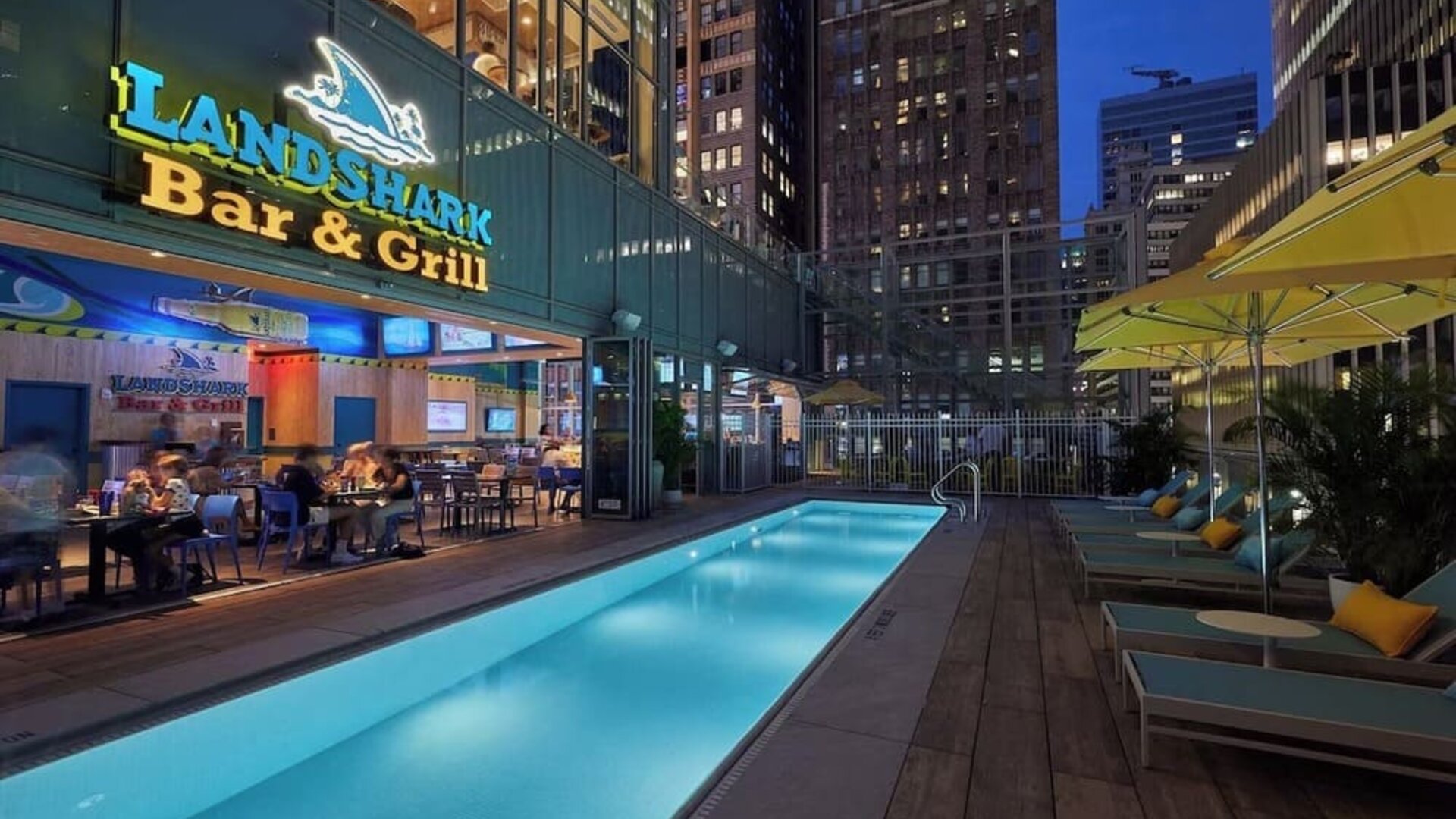 Outdoor pool at night at Margaritaville Resort Times Square.