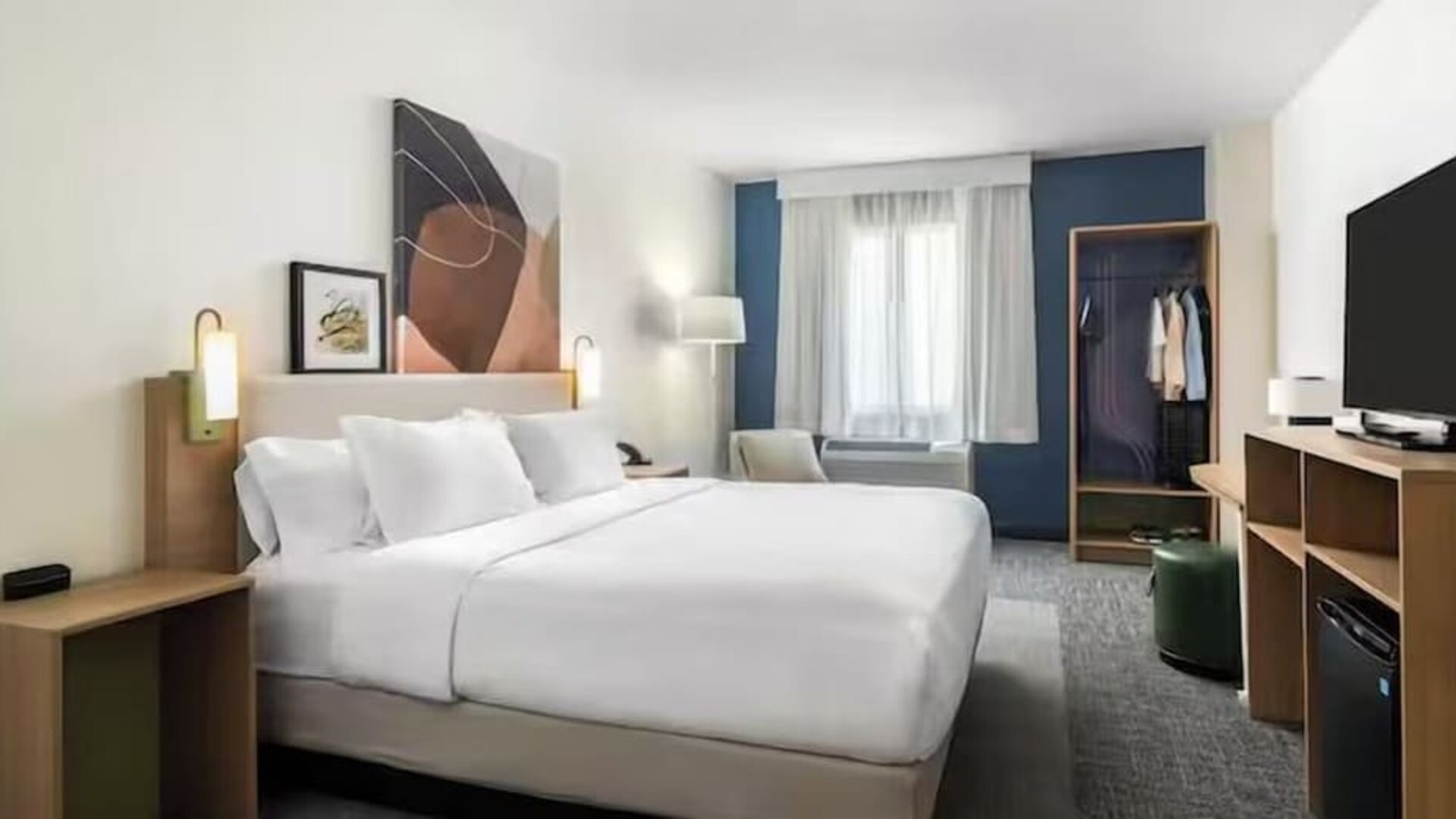 Day room with TV at Spark By Hilton Houston Hobby Airport.