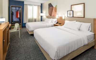 Day room with queen beds at Spark By Hilton Houston Hobby Airport.