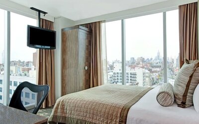 Day room with TV at Wyndham Garden Chinatown NYC.