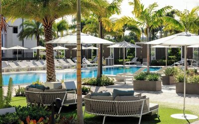 Lounge chairs beside the pool at Renaissance Boca Raton Hotel.
