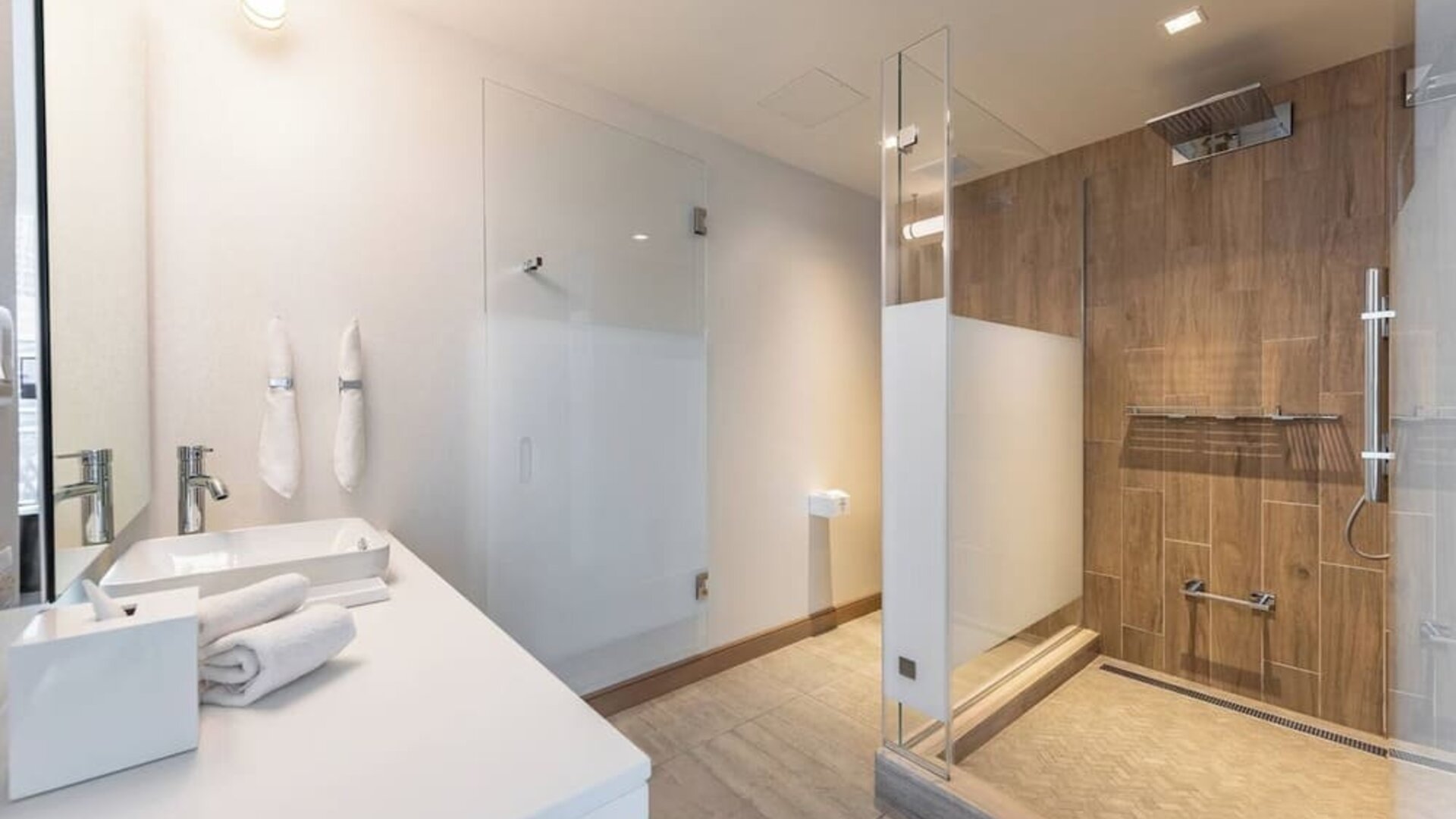 Guest bathroom with shower at The Envoy Hotel, Autograph Collection.