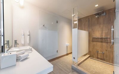 Guest bathroom with shower at The Envoy Hotel, Autograph Collection.