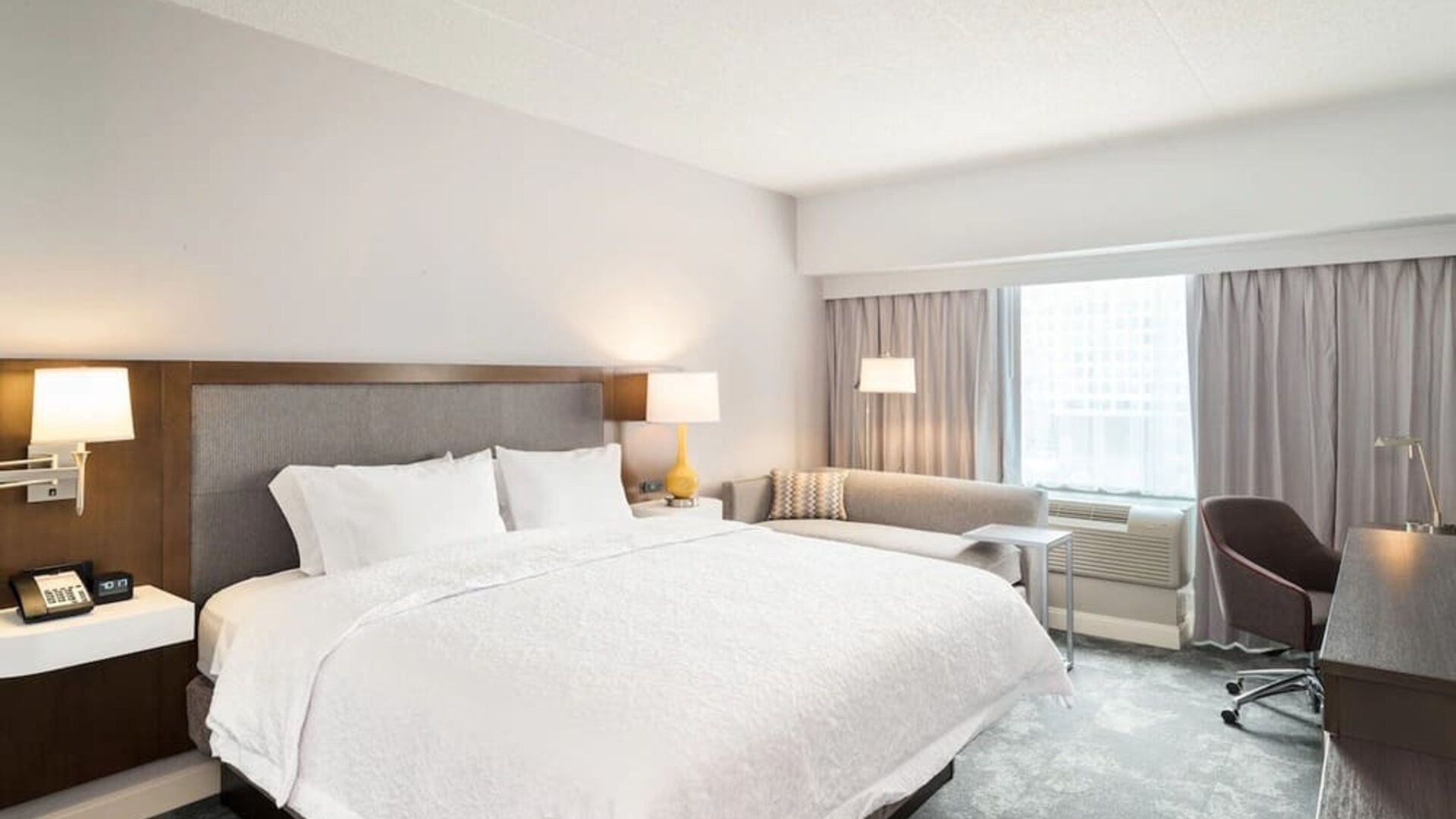 Day use room with work desk and sofa at Hampton Inn Philadelphia Center City - Convention Center.
