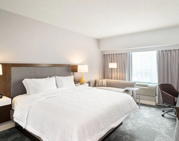 Day use room with work desk and sofa at Hampton Inn Philadelphia Center City - Convention Center.
