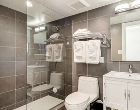 Guest bathroom with shower at Plunge Beach Resort.