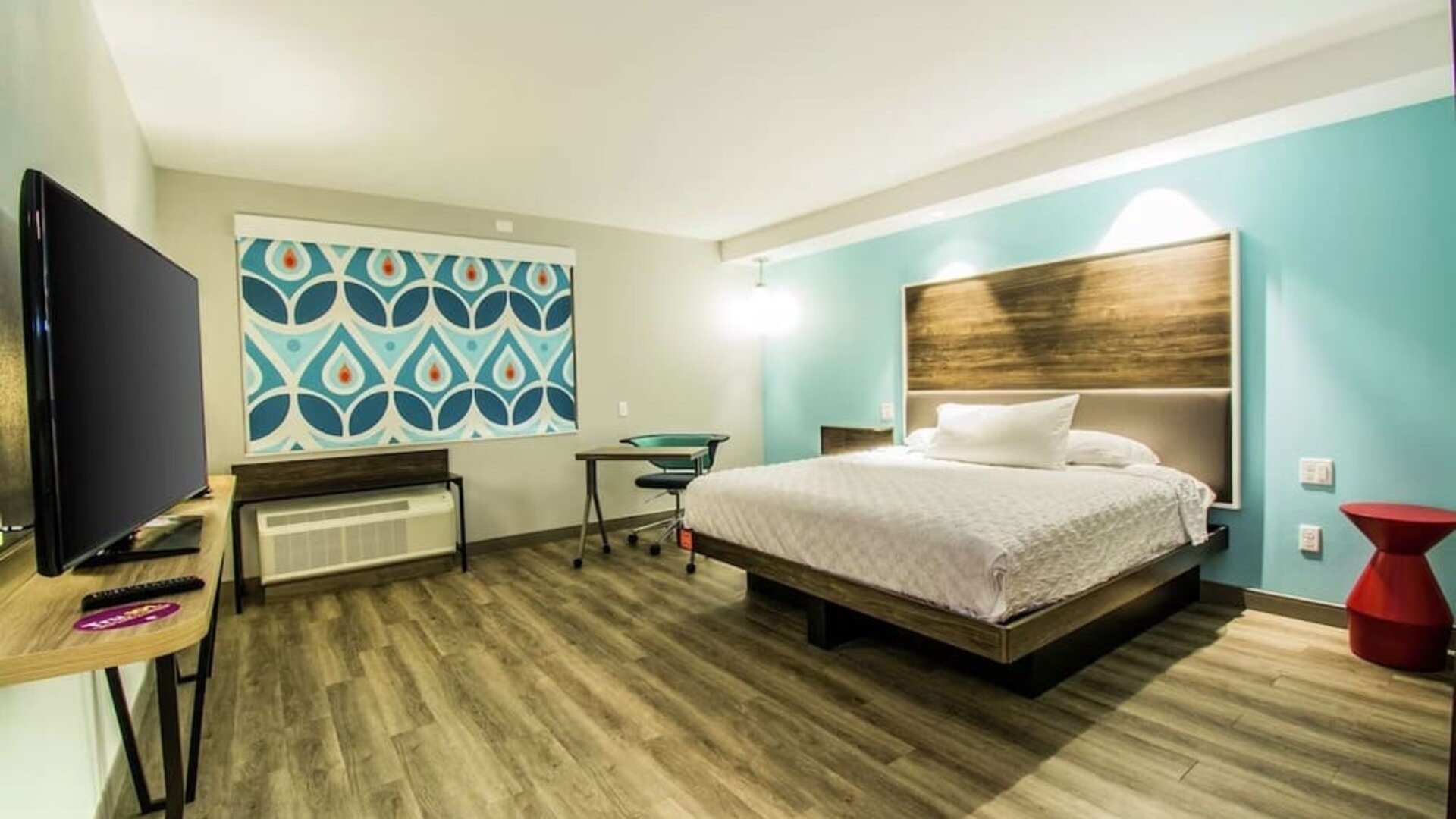 Cozy king-sized bed with TV at Tru By Hilton Bowling Green.