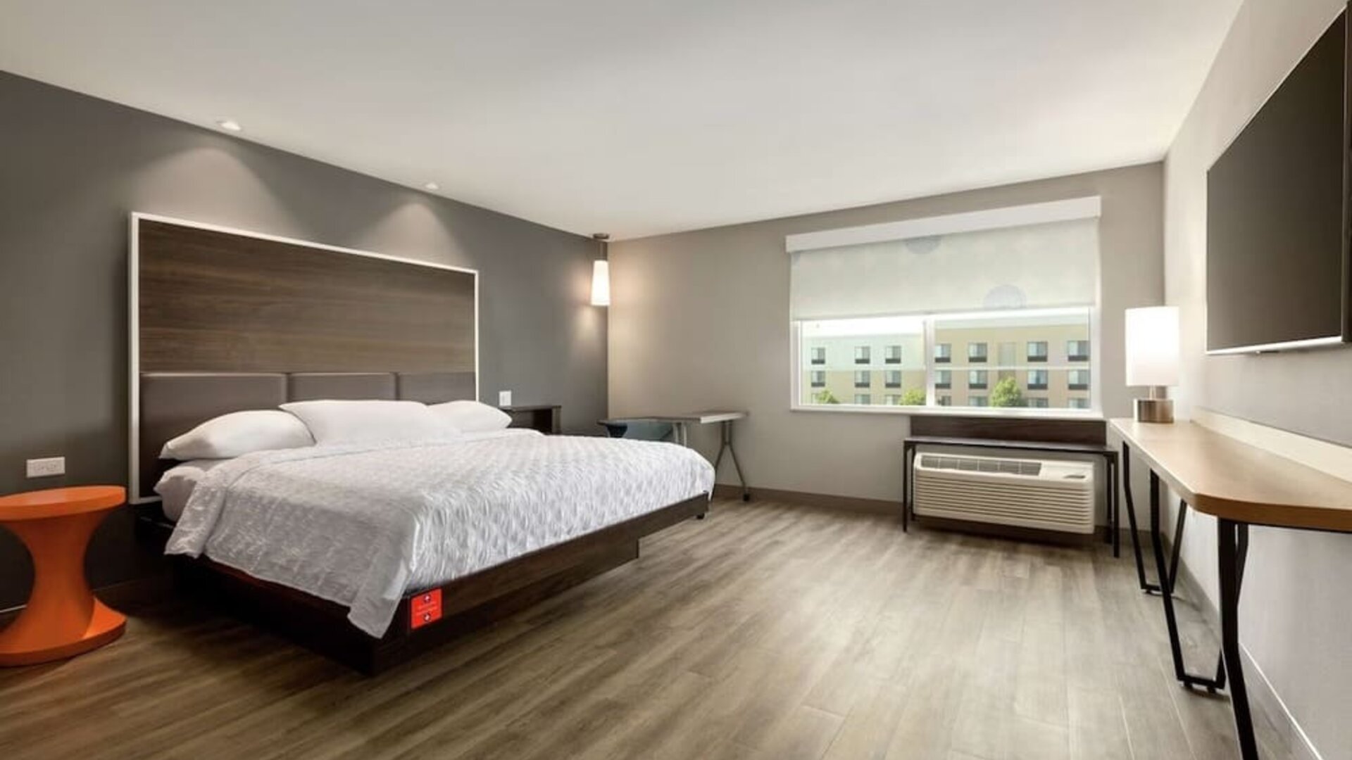 Spacious delux king bed with work desk at Tru By Hilton Wichita Northeast.
