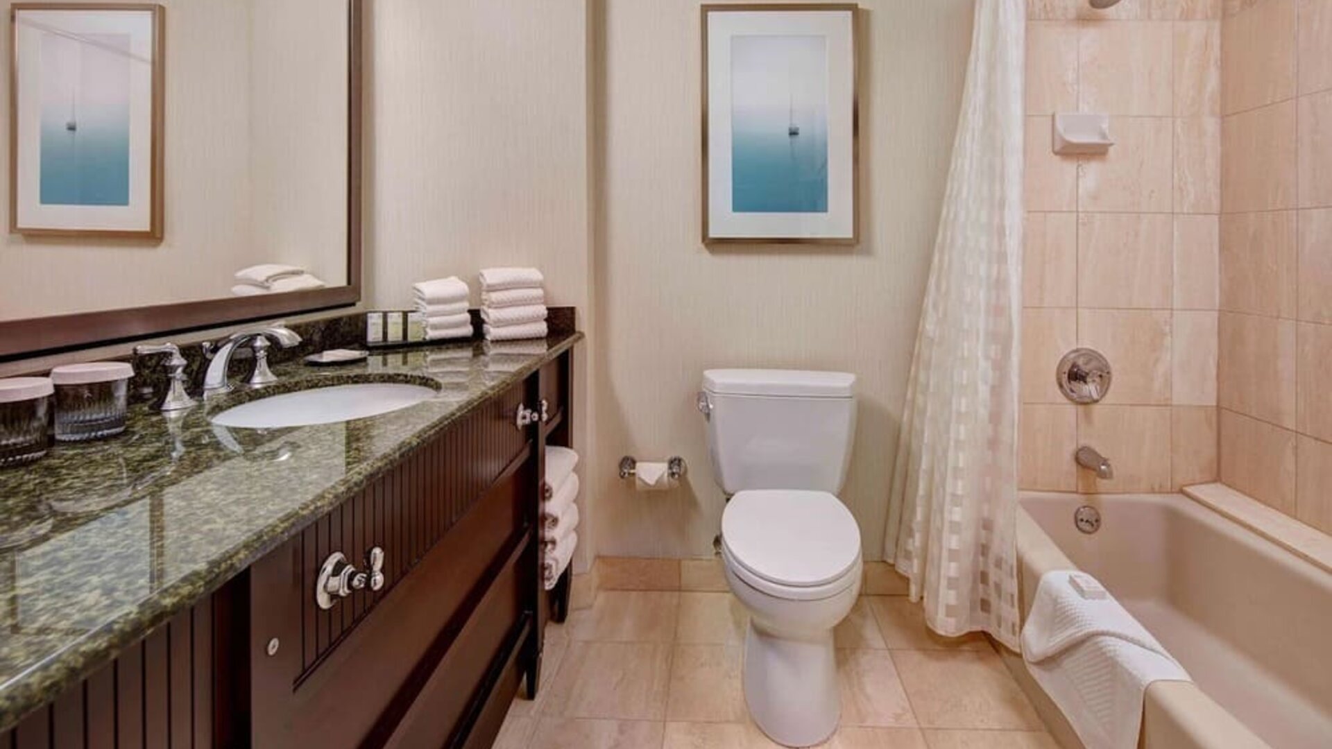 Private guest bathroom with free toiletries at Embassy Suites By Hilton San Diego-La Jolla.