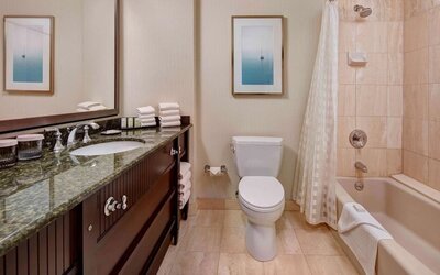 Private guest bathroom with free toiletries at Embassy Suites By Hilton San Diego-La Jolla.