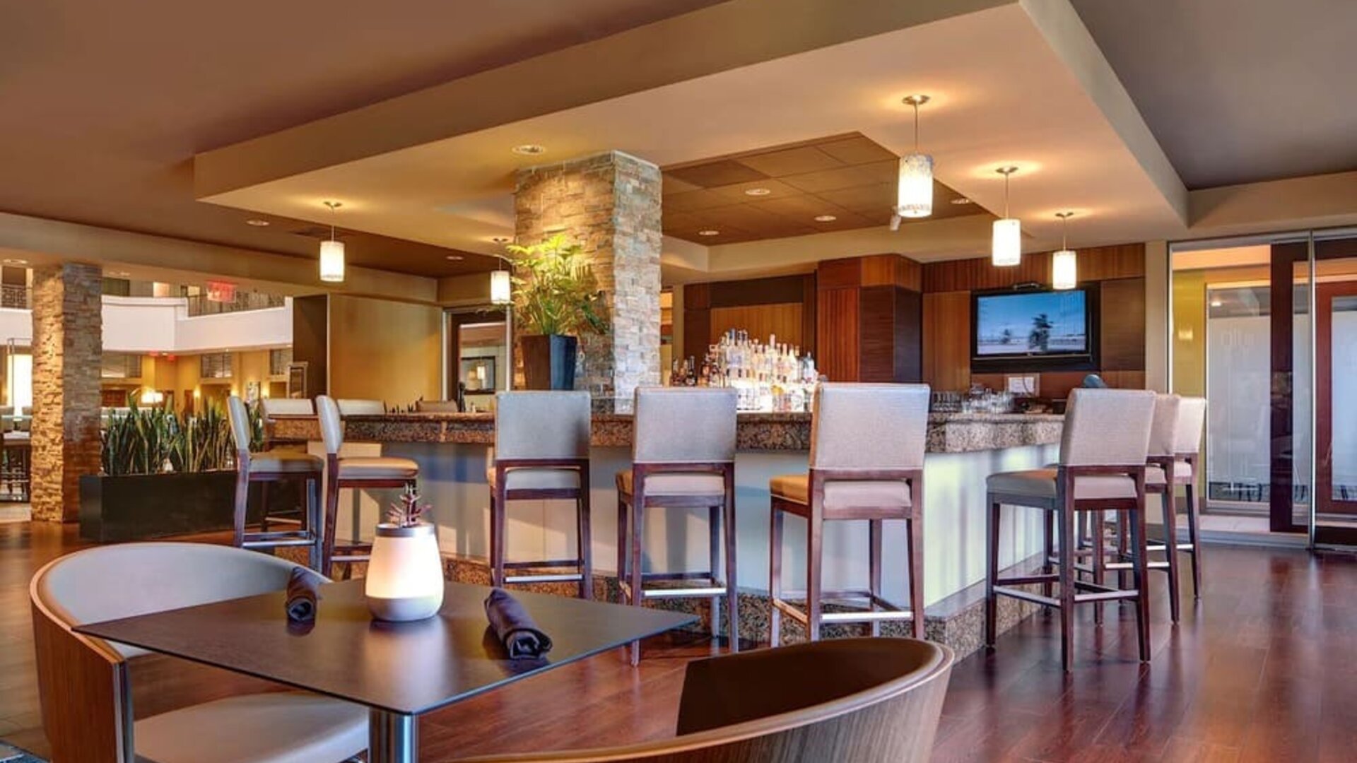 Hotel bar with lounge seating at Embassy Suites By Hilton San Diego-La Jolla.