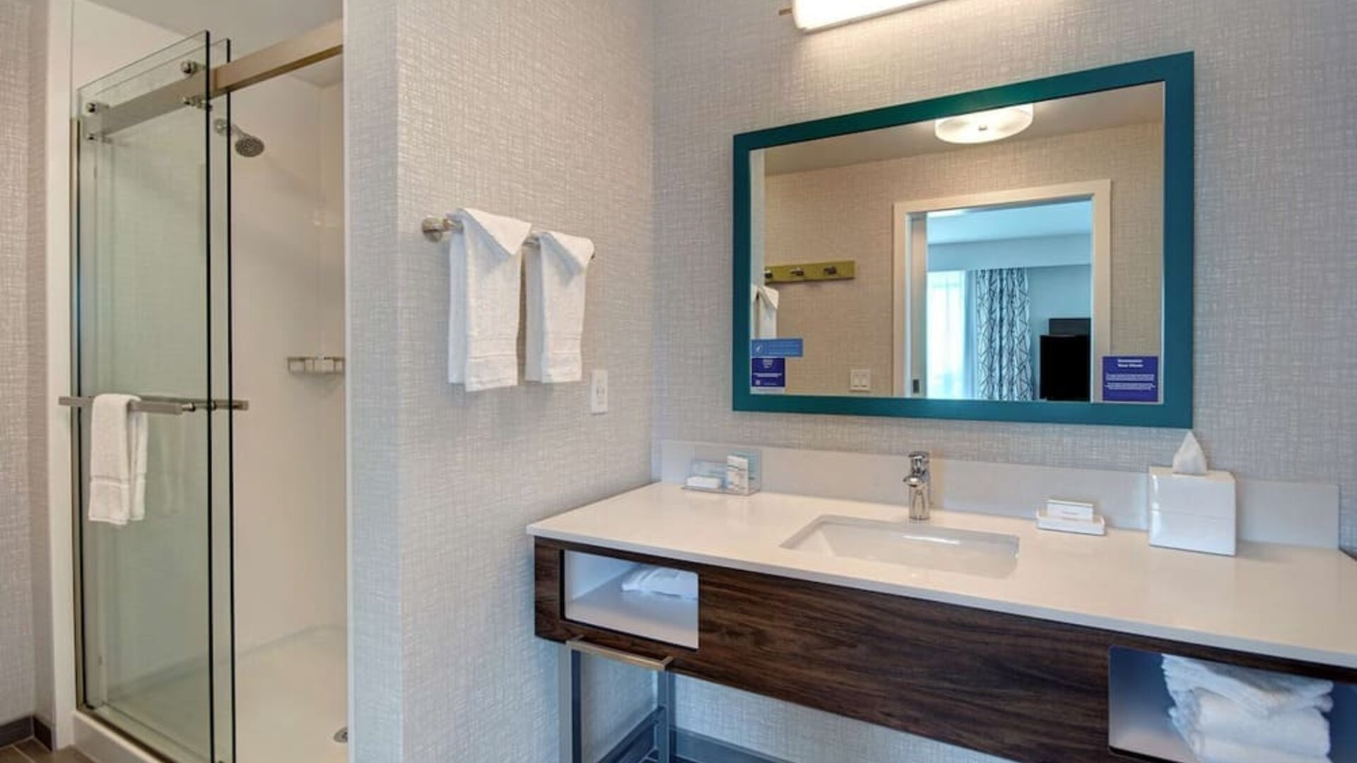 Guest bathroom with shower at Hampton Inn & Suites Sunnyvale Silicon Valley.