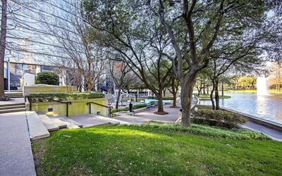 Courtyard beside private lake at Hilton Dallas Lincoln Centre.