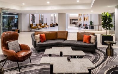 Lobby and coworking lounge at Hilton Dallas Lincoln Centre.