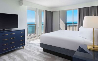 Day use room with balcony overlooking the ocean at Embassy Suites By Hilton Myrtle Beach Oceanfront Resort.