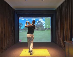 Golf simulators available at Embassy Suites By Hilton Myrtle Beach Oceanfront Resort.