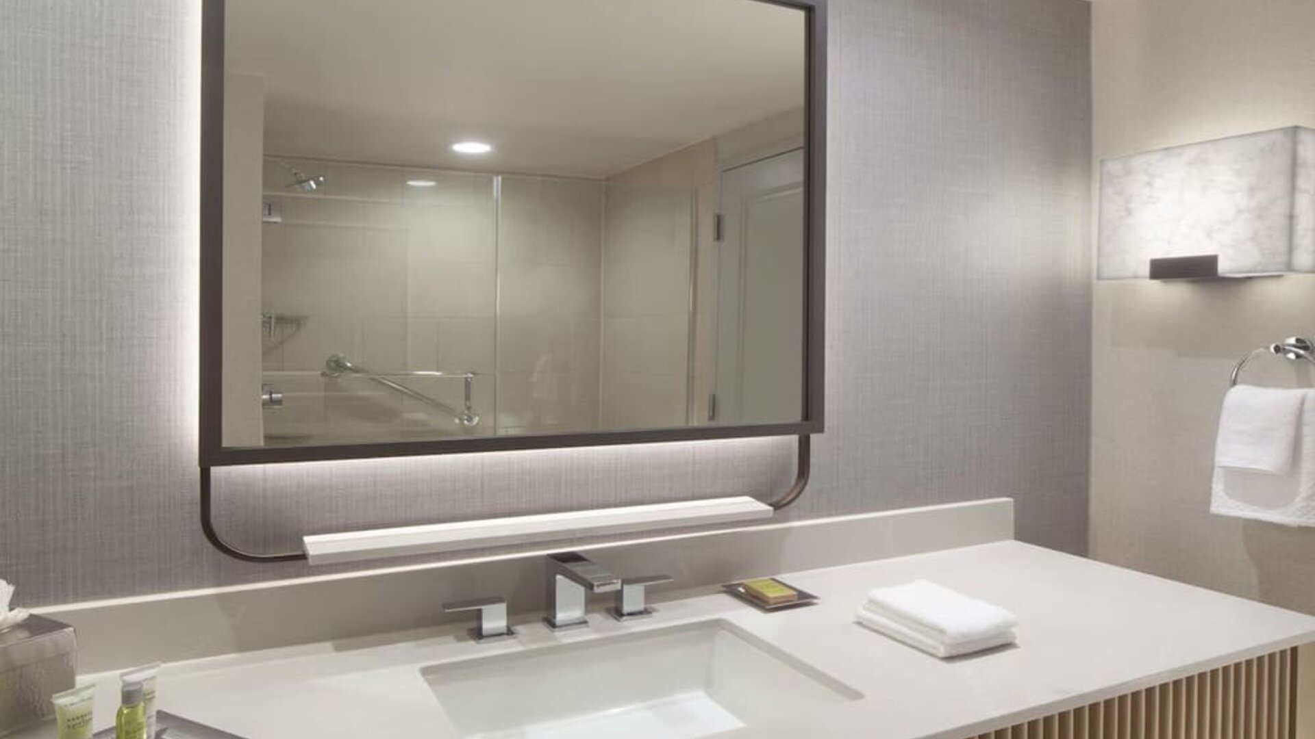 Guest bathroom with shower at Hilton Anatole.
