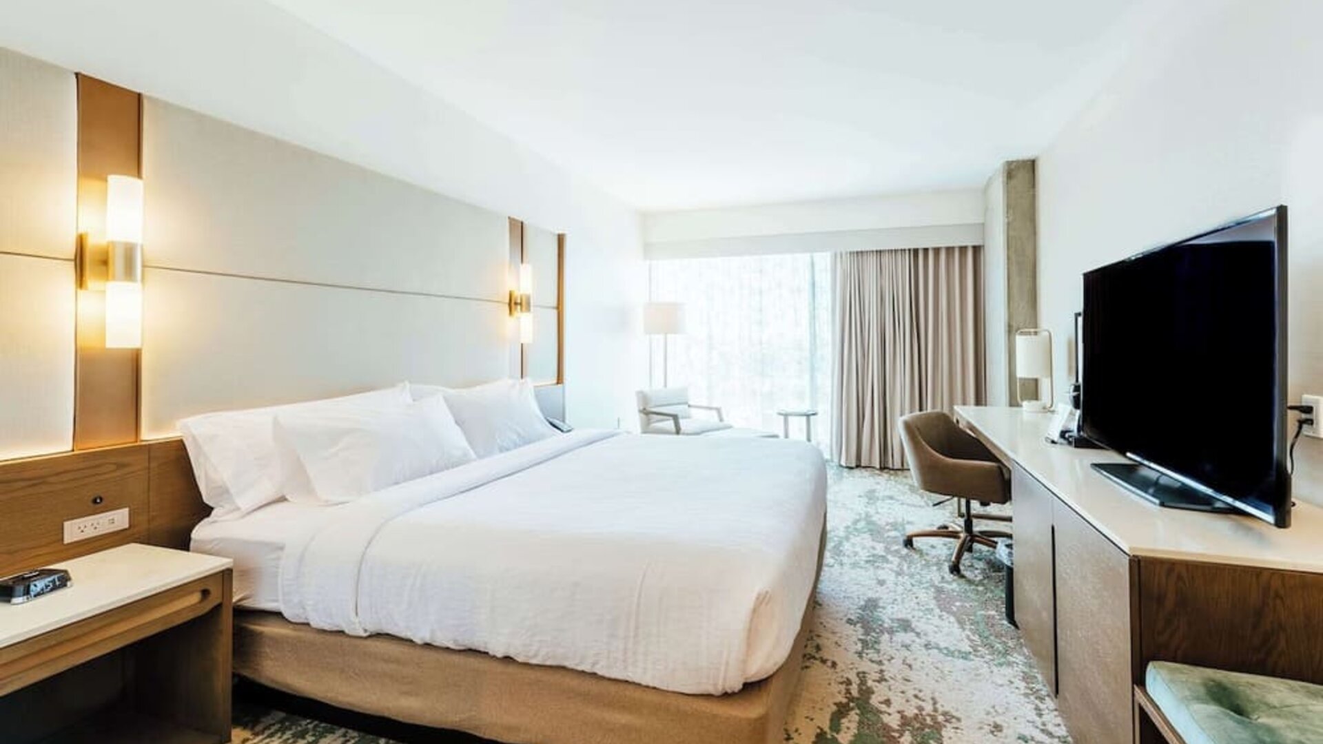 Day use room with work desk and natural light at Hilton Garden Inn Denver Union Station.
