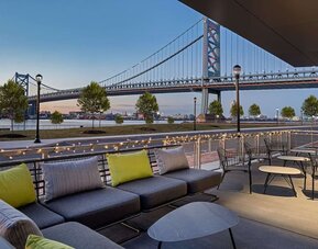 Outdoor furniture perfect for coworking at Hilton Garden Inn Camden Waterfront Philadelphia.