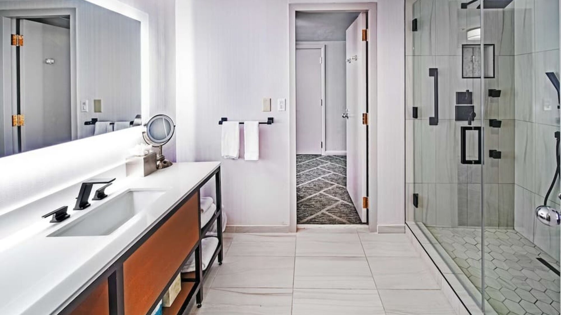 Guest bathroom with shower at DoubleTree By Hilton Tulsa - Warren Place.