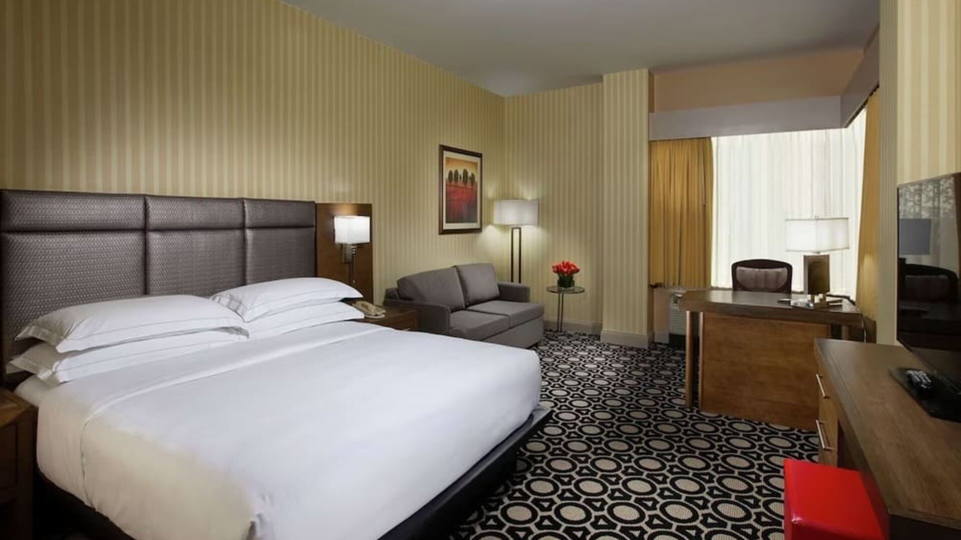 Day use room with work desk and sofa at Hilton Chicago-Northbrook.