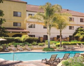 Refreshing outdoor pool surrounded by sun loungers at DoubleTree By Hilton Sonoma Wine Country.