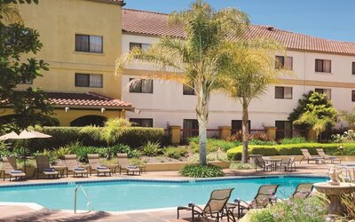 Refreshing outdoor pool surrounded by sun loungers at DoubleTree By Hilton Sonoma Wine Country.
