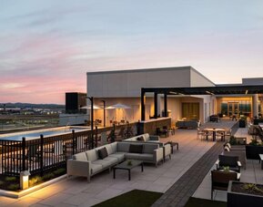 Hotel rooftop with lounge area and pool at Hilton BNA Nashville Airport Terminal.
