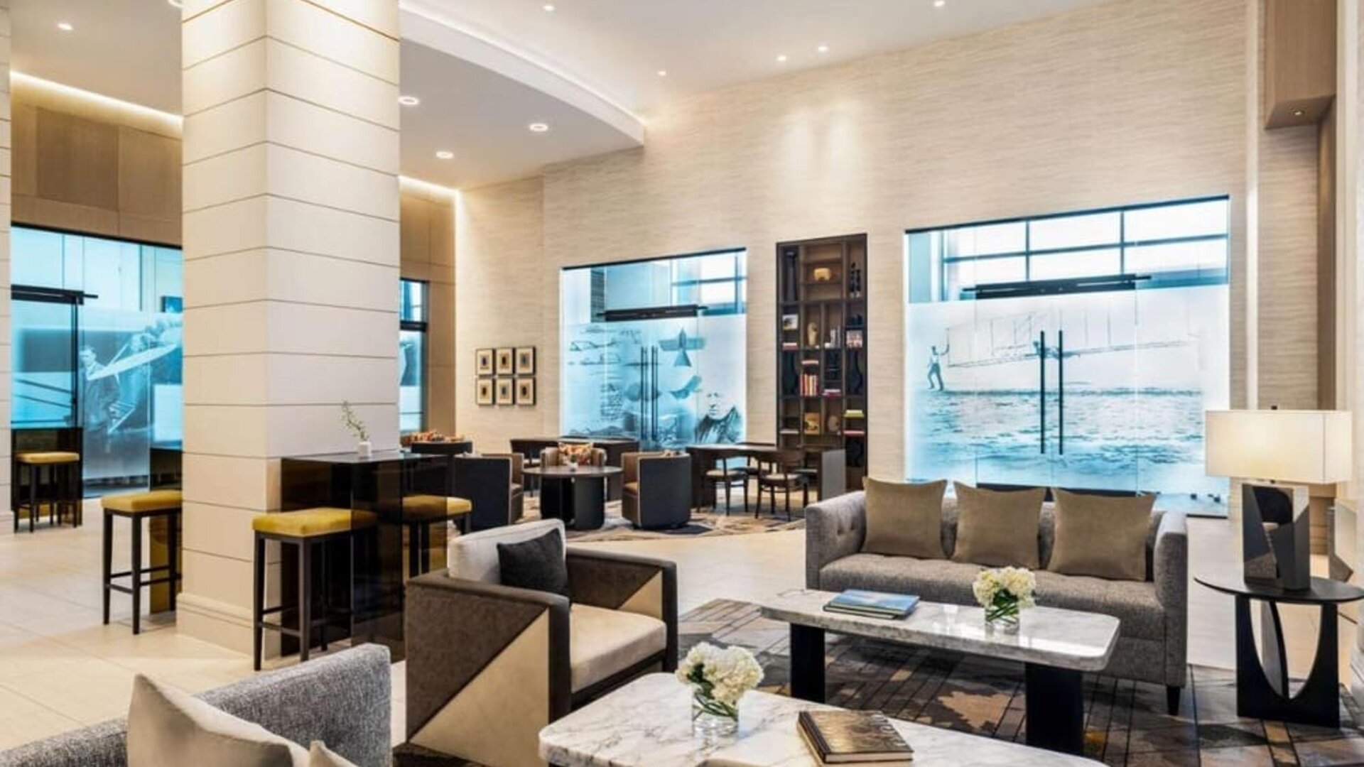 Hotel lobby with comfortable seating at Hilton BNA Nashville Airport Terminal.
