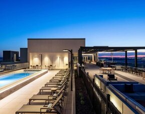 Beautiful rooftop with swimming pool and lounge area at Hilton BNA Nashville Airport Terminal.
