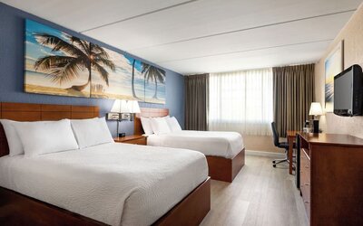 Day use twin room with work desk at EnVision Hotel Miami International Airport.