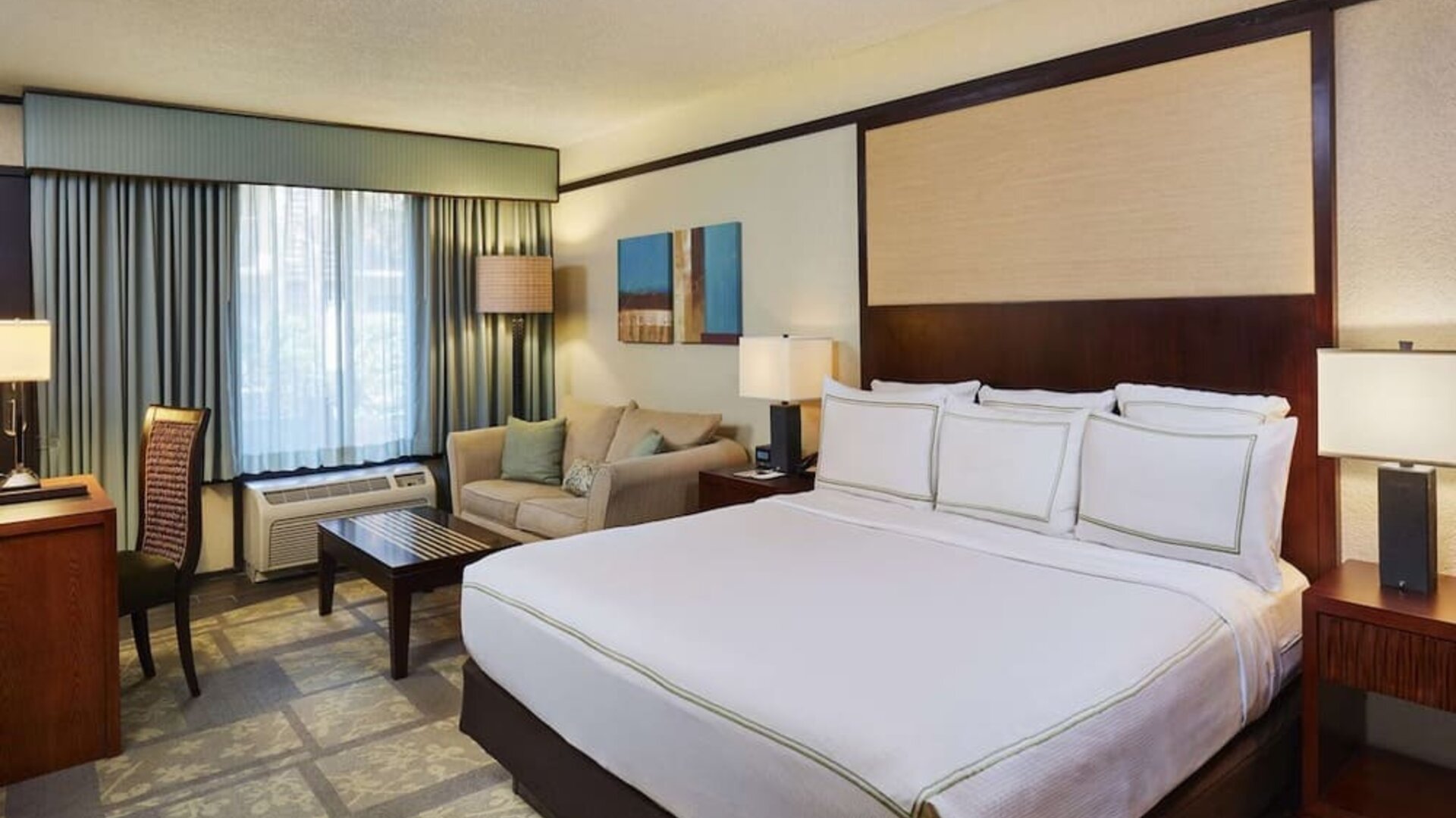 Day use room with sofa and work desk at DoubleTree By Hilton Orlando At SeaWorld.