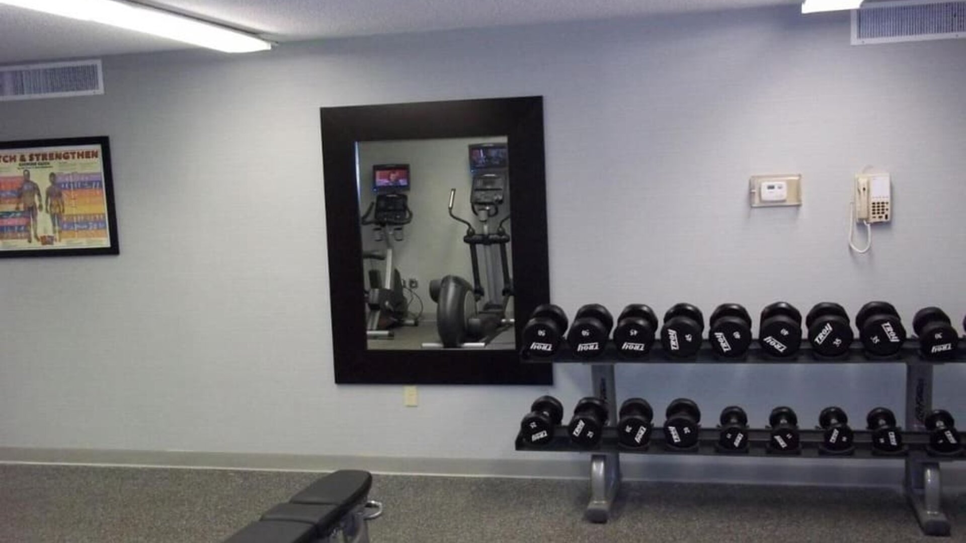 Fitness center at EnVision Hotel And Conference Center Mansfield Foxboro.