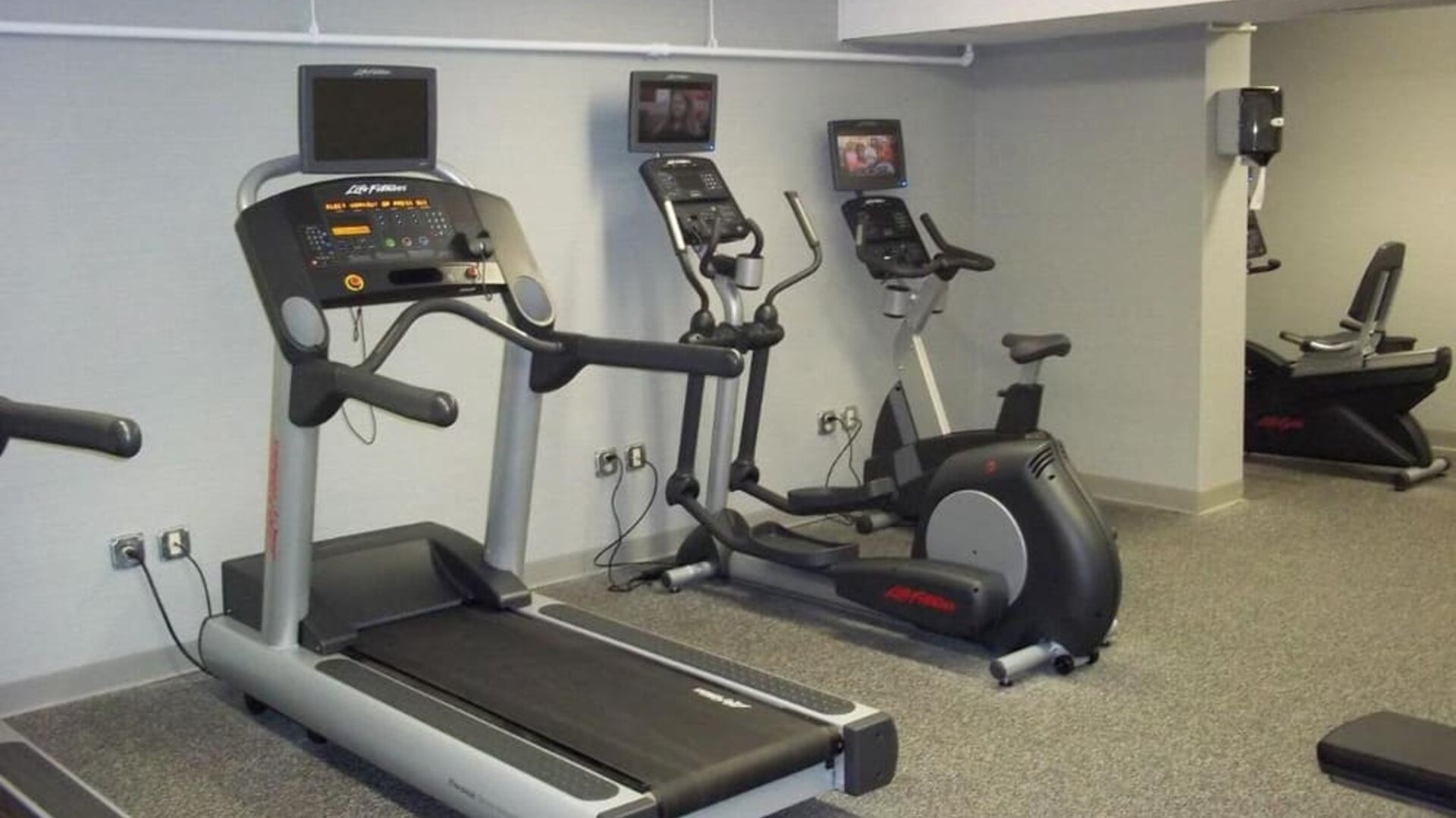 Well equipped fitness center at EnVision Hotel And Conference Center Mansfield Foxboro.