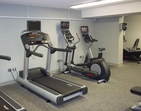 Well equipped fitness center at EnVision Hotel And Conference Center Mansfield Foxboro.