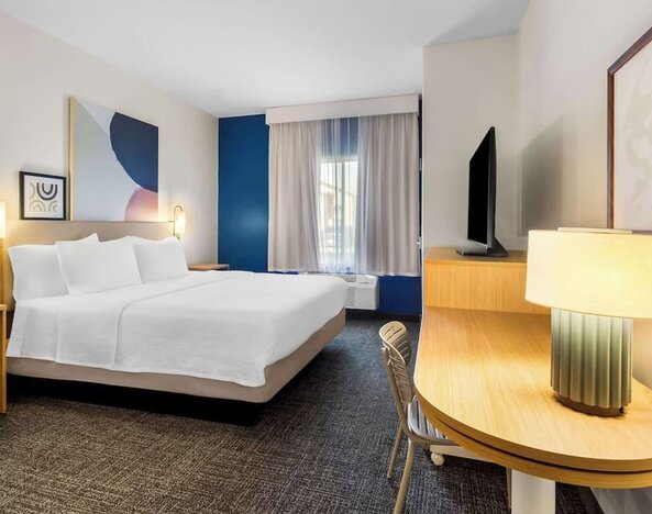 Day use room with natural light and work desk at Spark By Hilton Pearland.