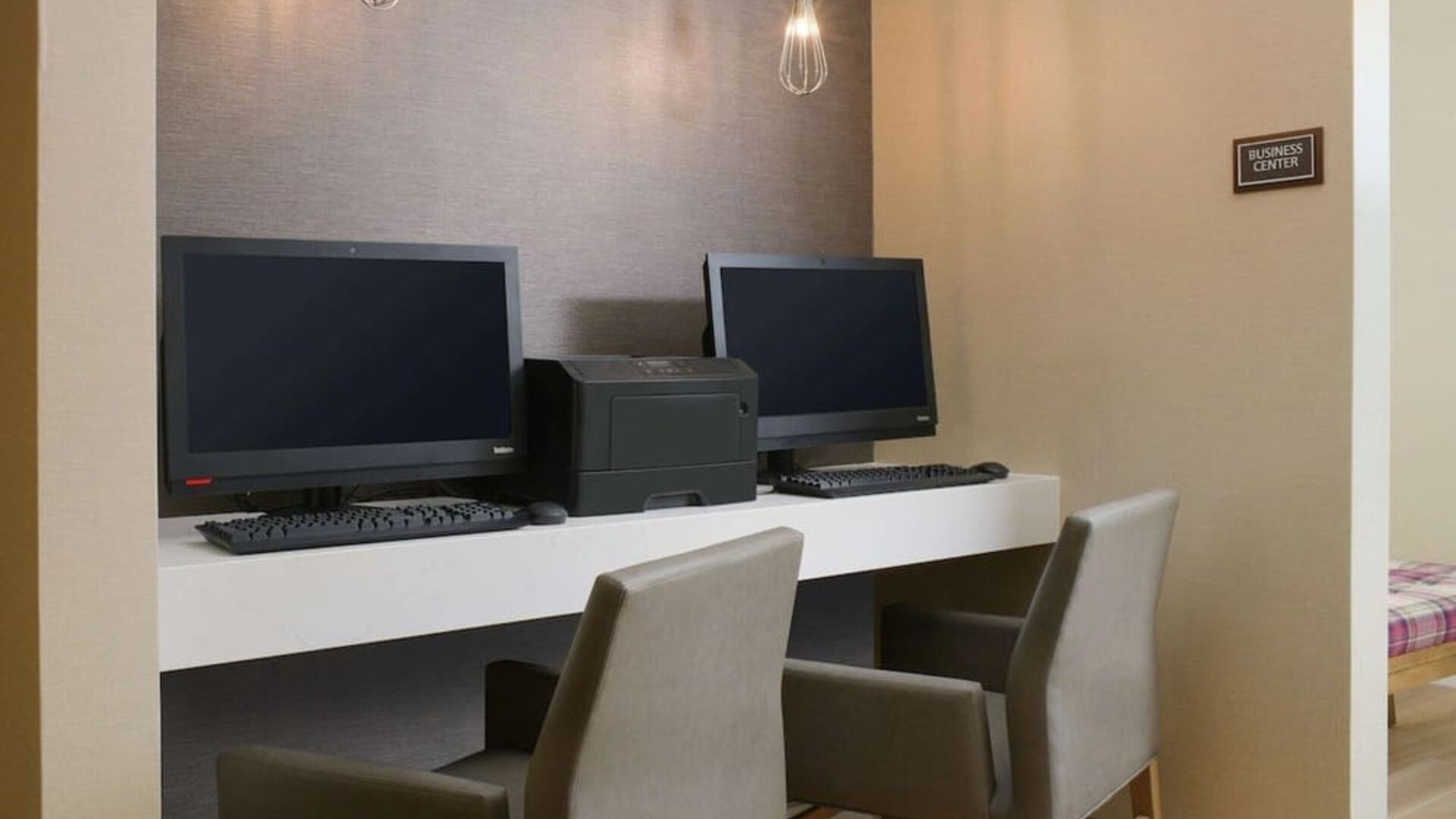 Business center with comfortable seating and printer at Sonesta ES Suites Fort Worth Fossil Creek.