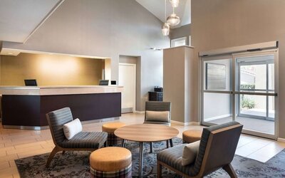 Hotel reception with lounge seating at Sonesta ES Suites Tempe.