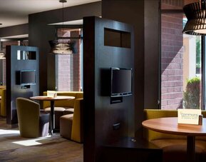 Dining area and coffee shop with comfortable seating perfect for coworking at Sonesta Select Tempe Downtown.