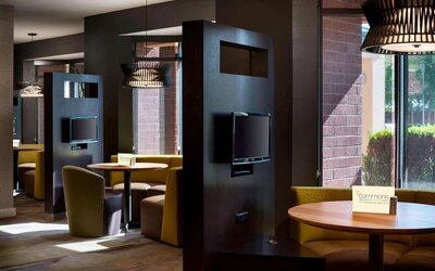 Dining area and coffee shop with comfortable seating perfect for coworking at Sonesta Select Tempe Downtown.