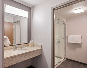 Private guest bathroom with shower and free toiletries at Sonesta Select Pleasant Hill.