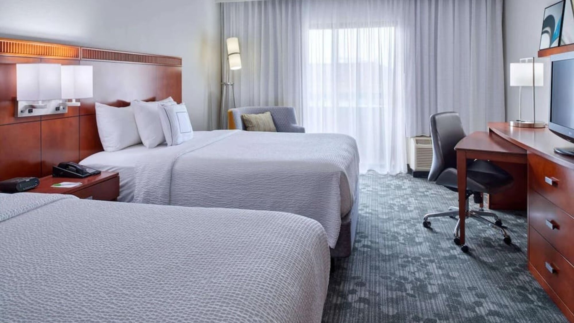 Bright and spacious day use twin room with work desk and floor to ceiling window at Sonesta Select Indianapolis Carmel.