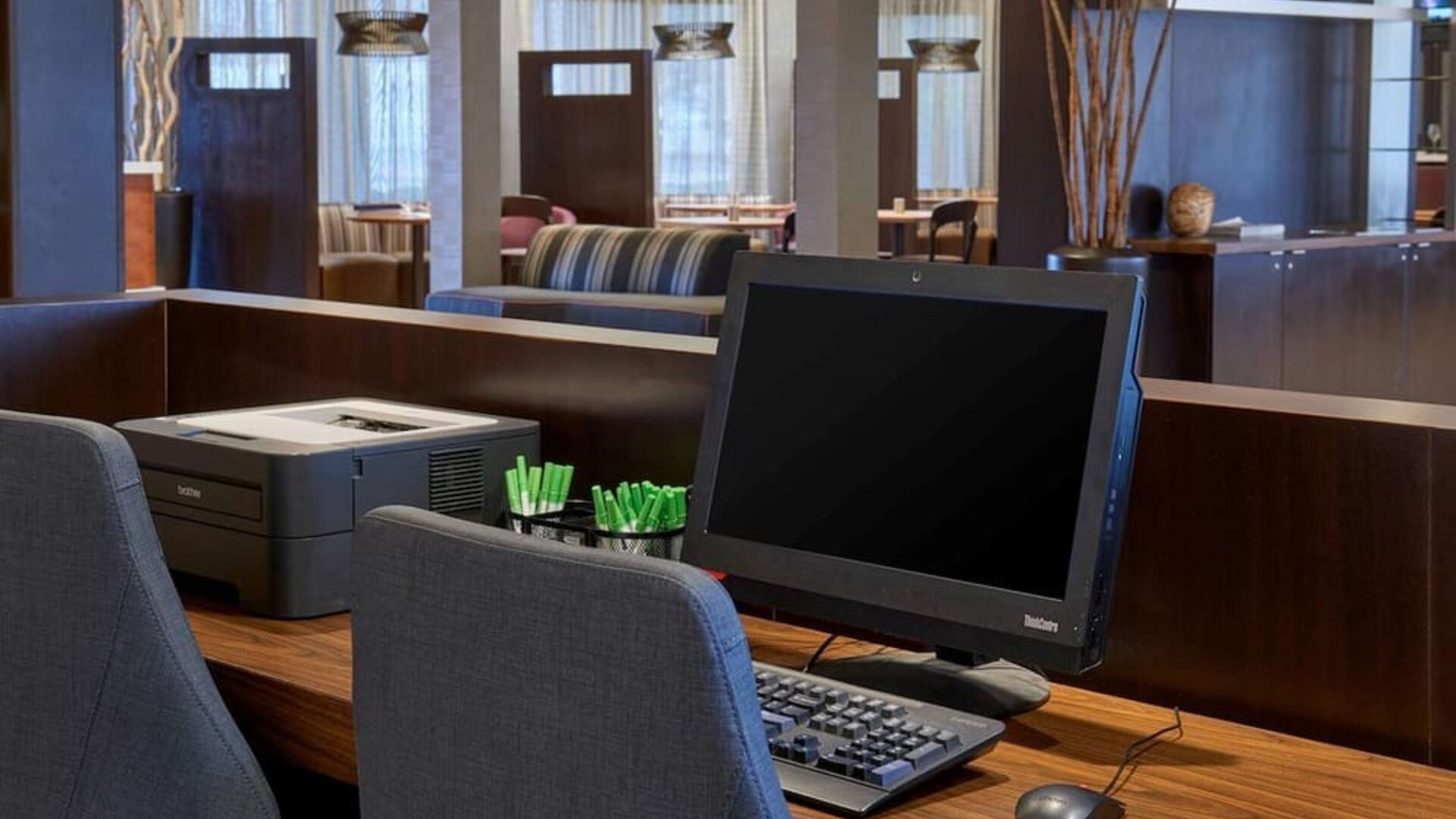 Business center with computer, printer and ergonomic chairs at Sonesta Select Indianapolis Carmel.