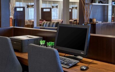 Business center with computer, printer and ergonomic chairs at Sonesta Select Indianapolis Carmel.